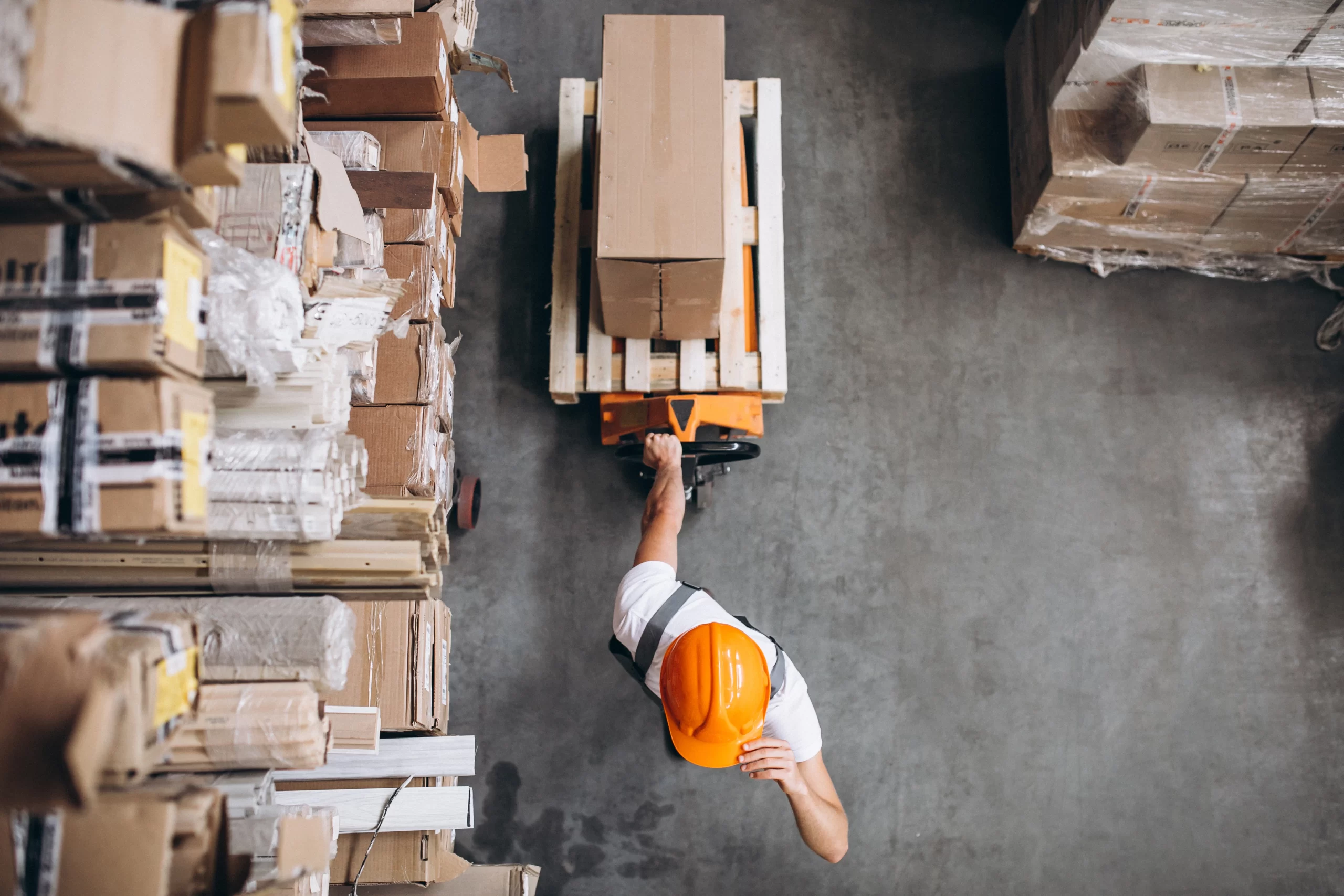 young man working warehouse with boxes